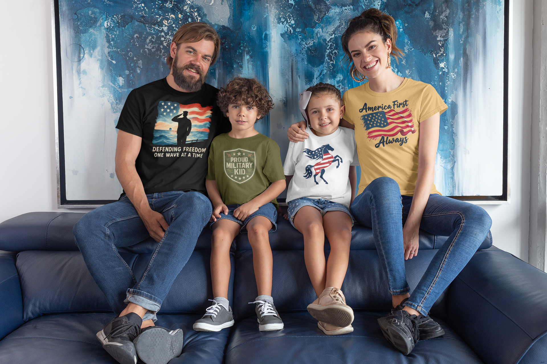 Family of four sitting on a blue couch wearing patriotic-themed shirts.